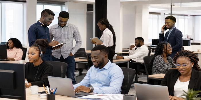 Fresh graduates working in entry-level roles across different industries in Ghana.