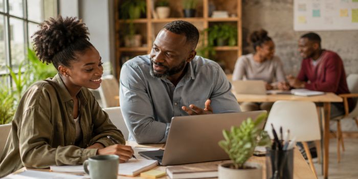 African professionals receiving workplace mentorship and career guidance